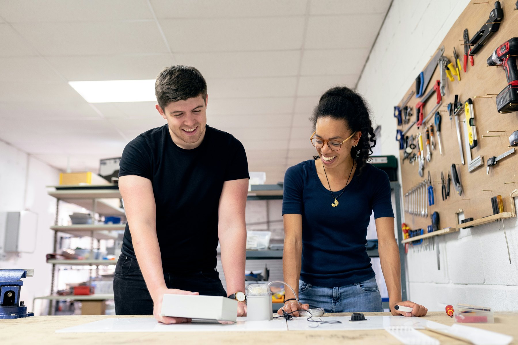 Two engineers collaborating over a technical project